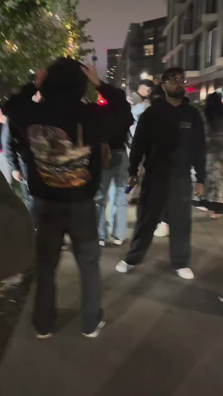 Friends wearing Safarwear hoodies and tees at a night event, ending with a live performance